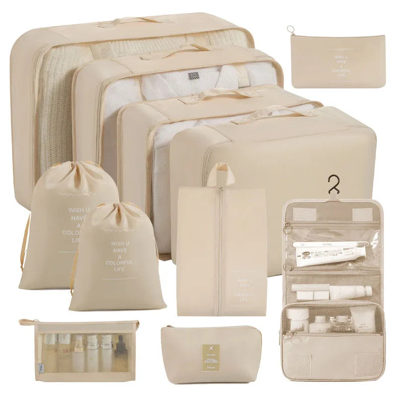 Collection of beige travel packing cubes and organizers on a white background